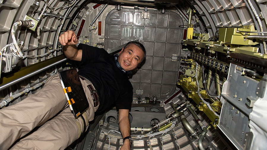 Astronaut Koichi Wakata is pictured inside the Kibo laboratory module's airlock where external payloads are placed into the outer space environment.