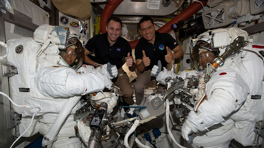 Astronauts (middle left to right) Josh Cassada and Frank Rubio pose with spacewalkers (far left and right) Nicole Mann and Koichi Wakata following the completion of a spacewalk on Jan. 20, 2023.