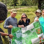 People look at a map in Belize