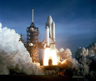 A space shuttle during liftoff