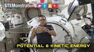 Astronaut Joe Acaba holding a ball on the International Space Station to demonstrate Kinetic and Potential Energy