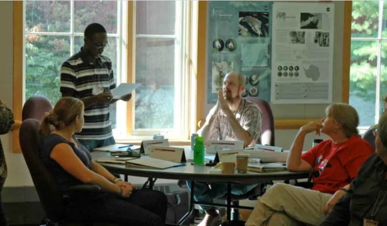 A group of people sitting around a table