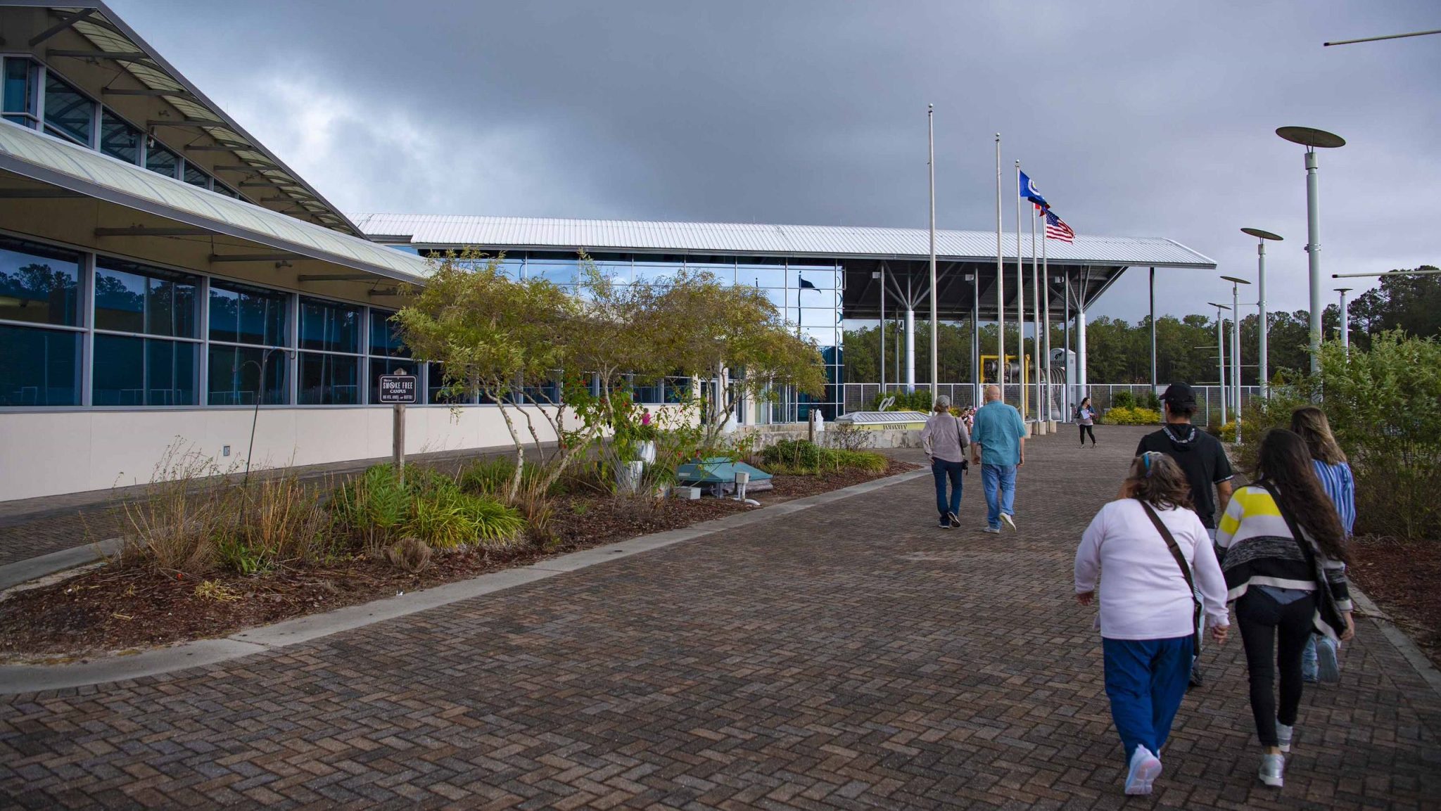 visitors walking toward the main entrance at INFINITY Science Center