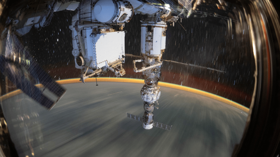 This long-duration photograph shows the Earth 259 miles below a soaring International Space Station on Sept. 19, 2022. In the foreground, is the Soyuz MS-21 crew ship docked to the Prichal docking module which is itself attached to the Nauka multipurpose laboratory module.