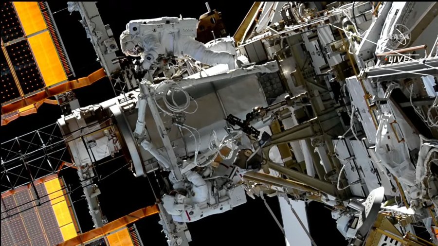 Spacewalkers Koichi Wakata (top) and Nicole Mann (bottom) work on the starboard truss structure to upgrade the space station's power generation system.