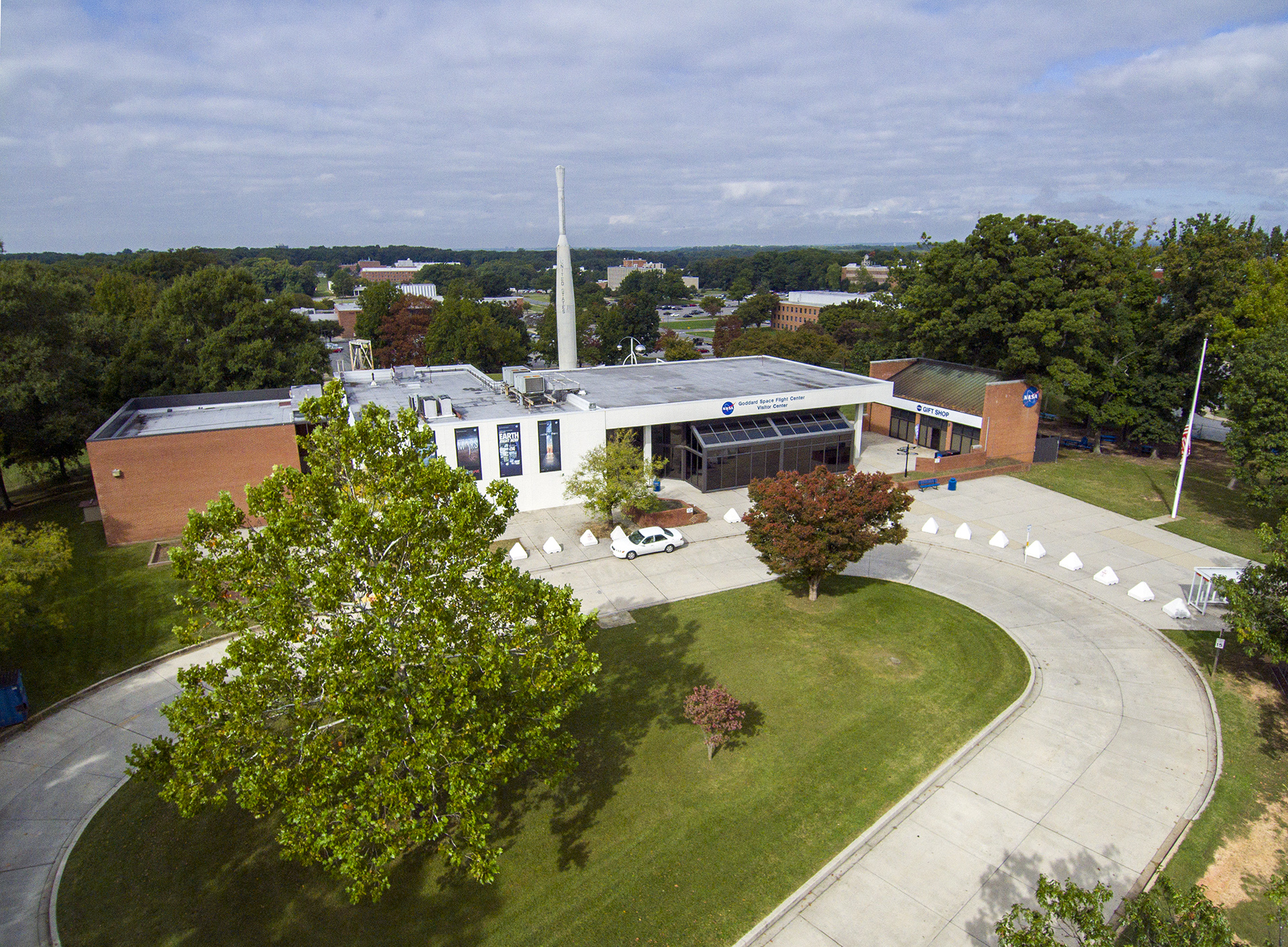 Aerial view of the Goddard Visitor center, including bus loop and gift shop.