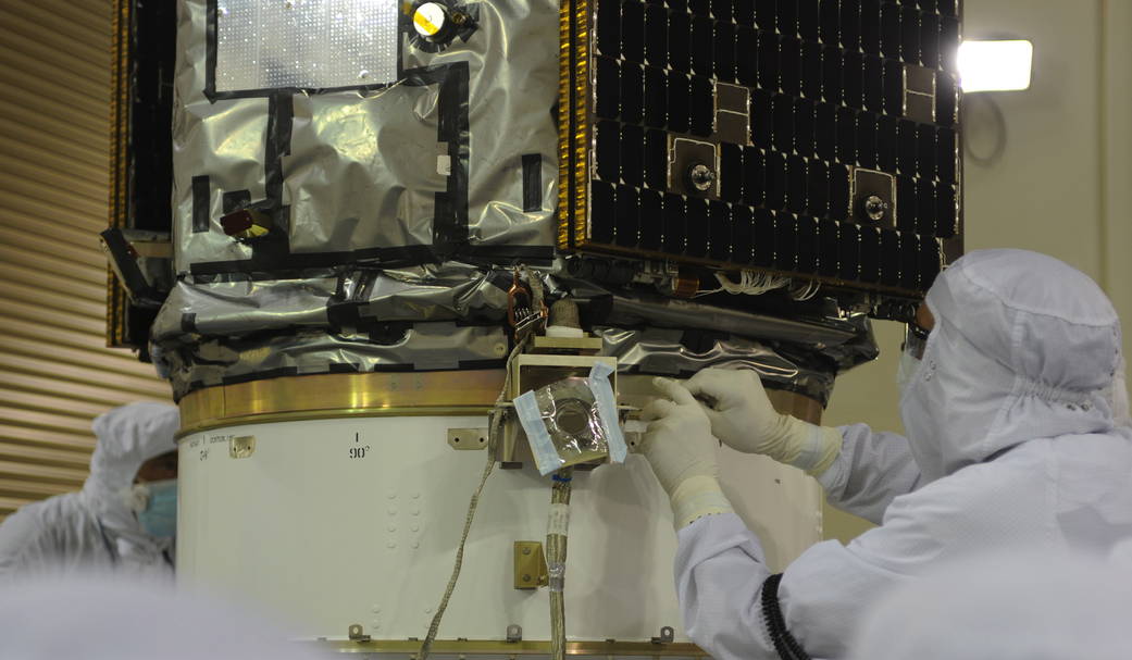 Technician working on NASA's OCO-2