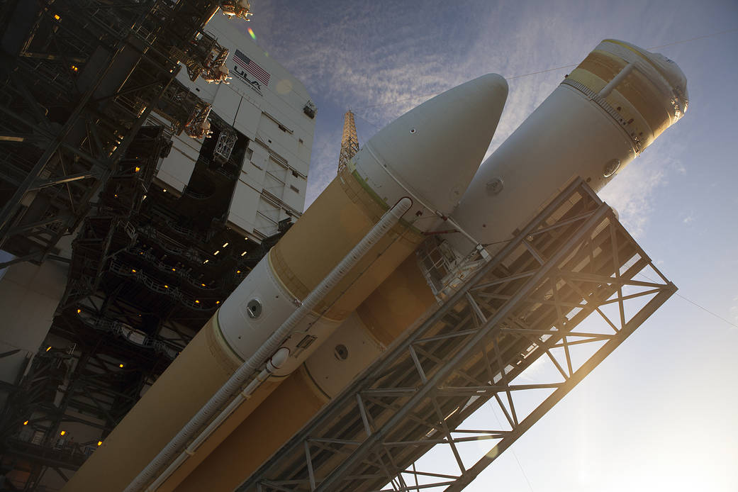 This close-up view shows the United Launch Alliance Delta IV Heavy rocket being raised into the vertical position at the launch 