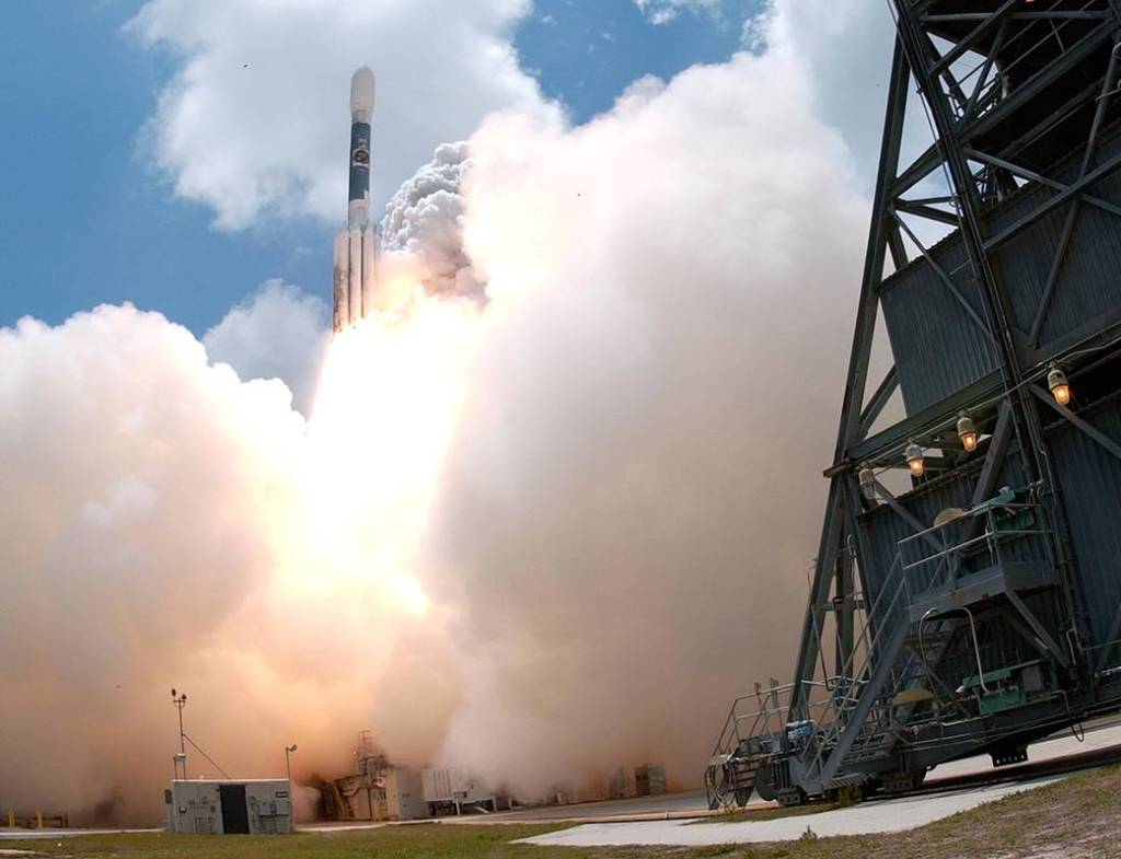 The Delta II rocket carrying NASA's Gamma-Ray Large Area Space Telescope (GLAST) emerges from the smoke generated at liftoff from Cape Canaveral Air Force Station's Launch Pad 17-B. The rocket lifted off June 11, 2008 at 12:05 p.m. EDT.