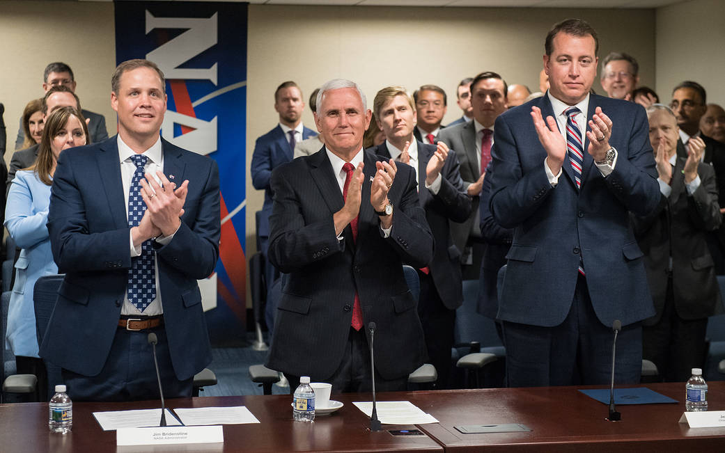 Administrator Bridenstine, Vice President Pence and NASA CFO Jeff DeWit stand and applaud