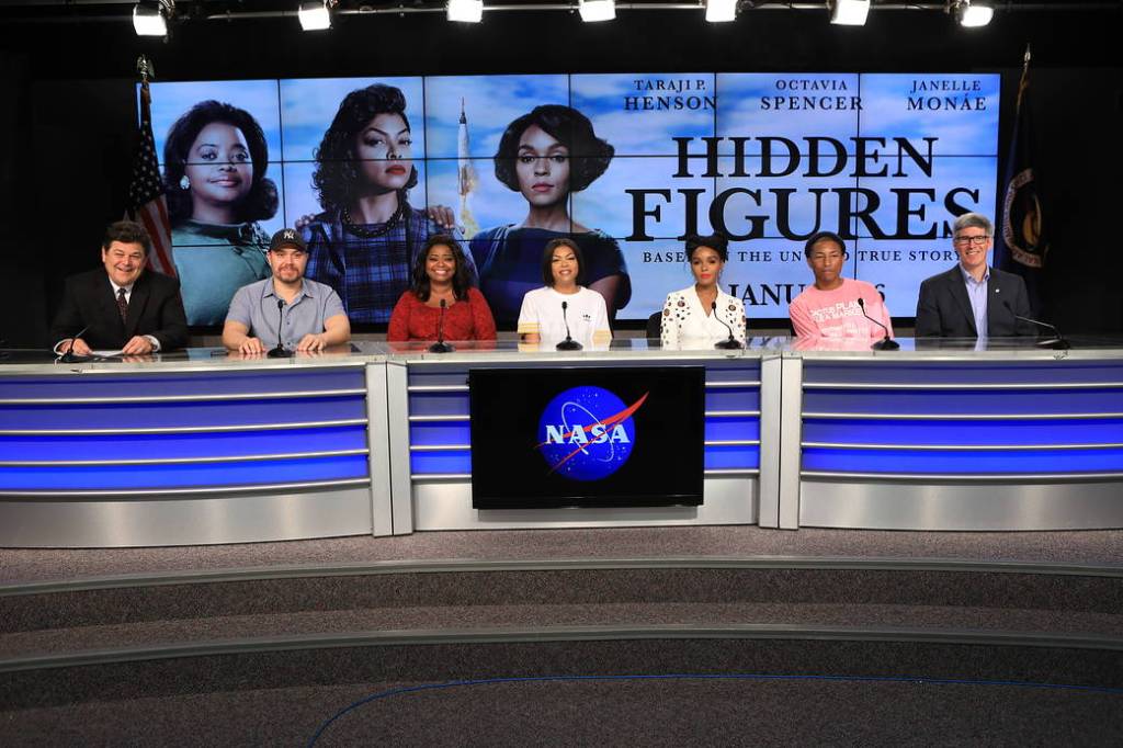 Cast members of Hidden Figures film and NASA officials seated at press conference