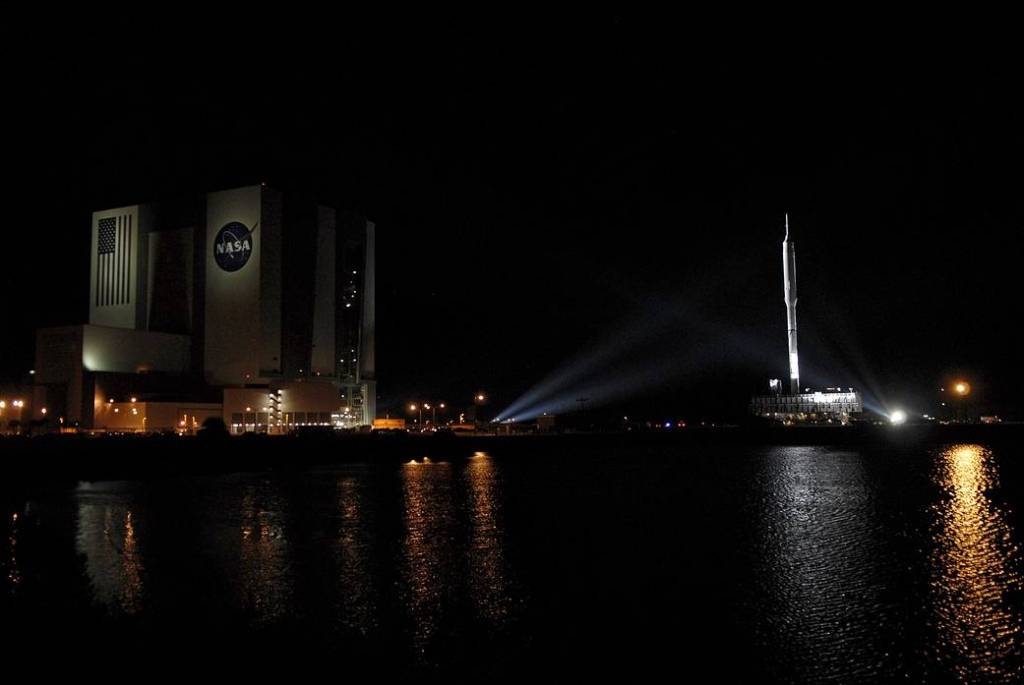 The towering 327-foot-tall Ares I-X rocket moves away from the Vehicle Assembly Building at NASA's Kennedy Space Center in Florida.