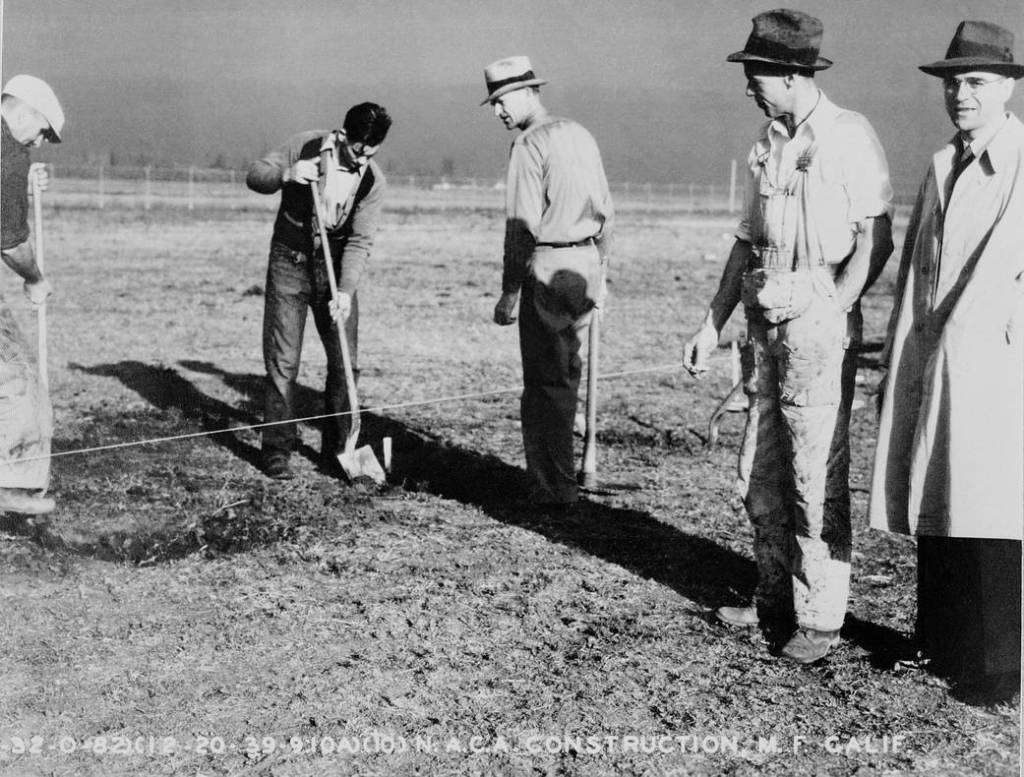 Shown is Russell Robinson (right) supervising the first excavation for the Ames laboratory on Dec. 20, 1939.