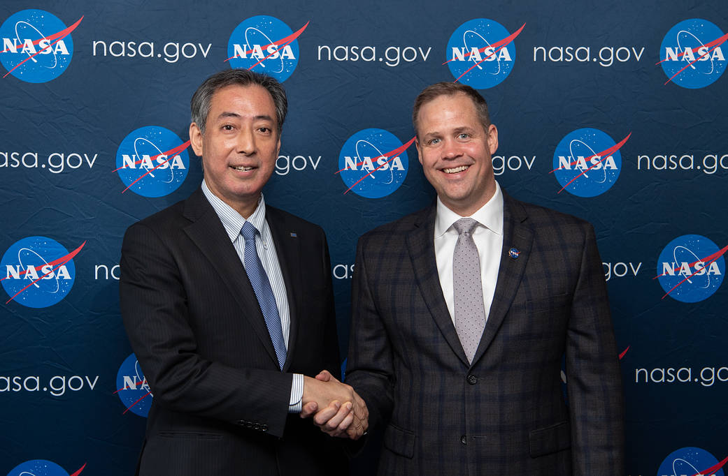 NASA administrator shakes hands with JAXA president