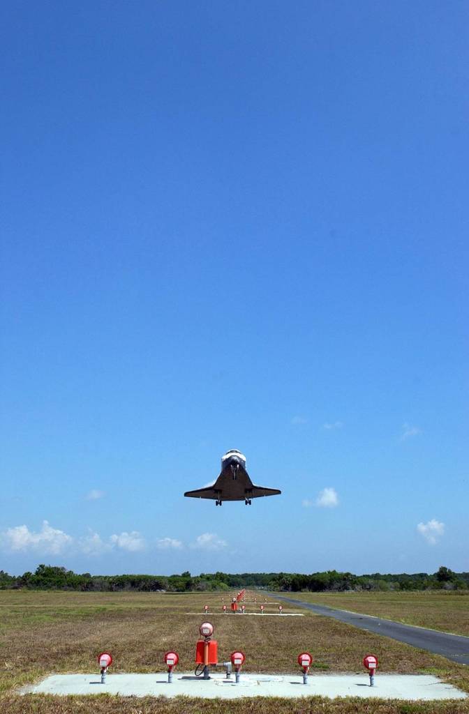 Space shuttle Discovery drops from the blue sky preparing to land on Runway 15 at NASA's Kennedy Space Center. This 69th landing at Kennedy ended the STS-124 mission, a 14-day flight to the International Space Station. 