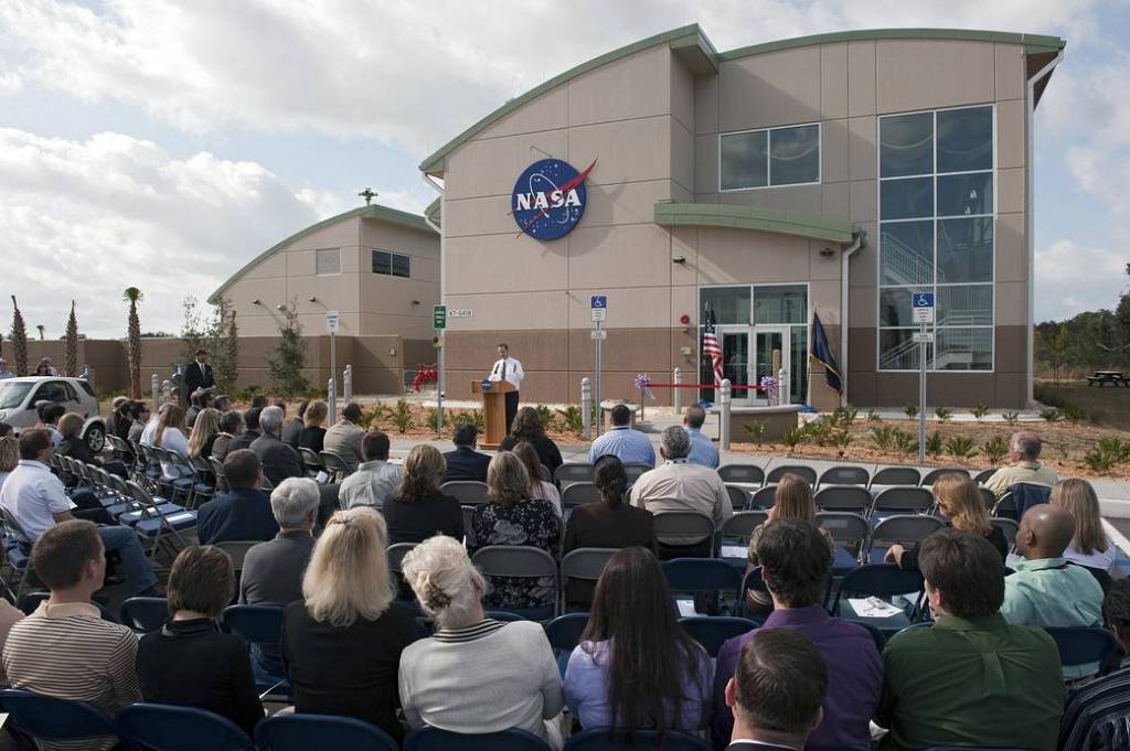 A crowd gathers for a ribbon cutting ceremony for the new environmentally friendly Propellants North Administration and Maintenance Facility at Kennedy Space Center.