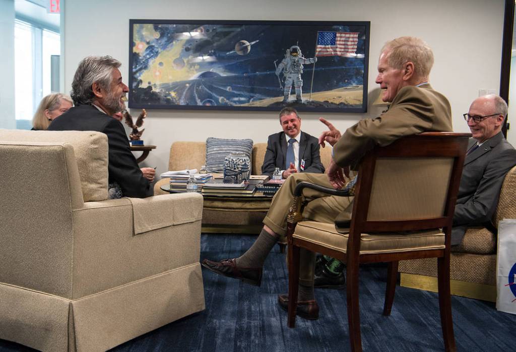 In this photo, members of NASA's administrative team speak with high-ranking members of the Argentinian space agency, CONAE, while seated around a table at NASA Headquarters in Washington, DC.