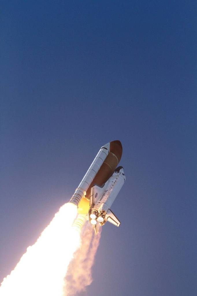 Space shuttle Discovery heads to space after lifting off from Launch Pad 39A at Kennedy Space Center to begin its final flight to the International Space Station on the STS-133 mission.