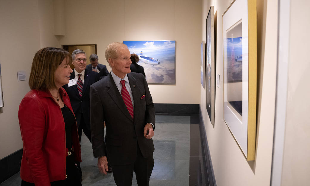 Colleen Hartman, director of physics, aeronautics, and space science at the National Academies of Science , left, and NASA Administrator Bill Nelson are seen as they view the NASA Art Program Exhibition