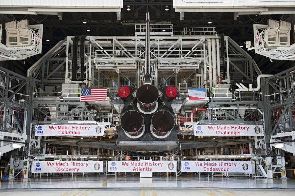 Shuttle Atlantis' three main engines take center stage to the banners commemorating the orbiters that served the Space Shuttle Program.