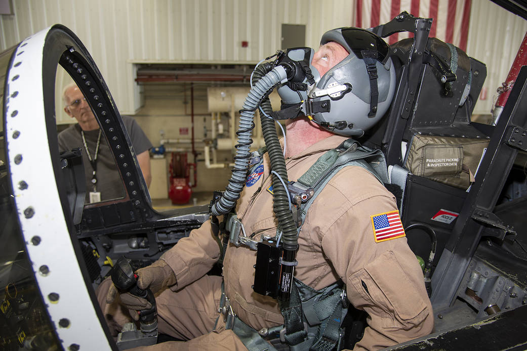 NASA pilot Jim Less is assisted by life support as he is fitted with a Cobham designed VigiLOX pilot oxygen monitoring system. 