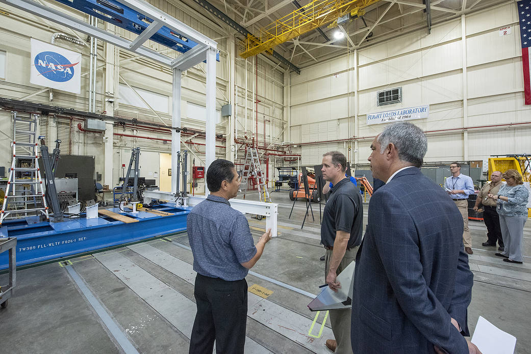 NASA Administrator Bridenstine talks with Armstrong’s Larry Hudson about the capabilities of the Flight Loads Lab.