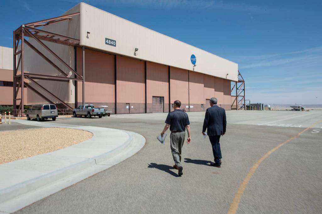 Bridenstine and McBride walking together at AFRC.