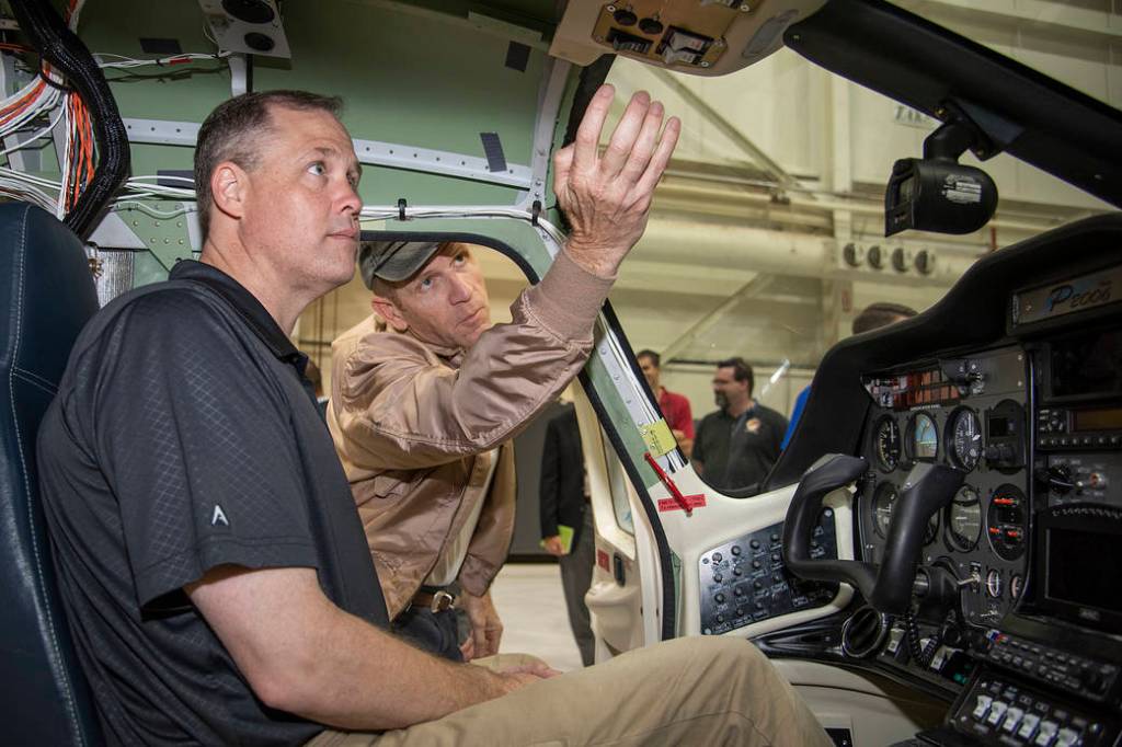 NASA Administrator Jim Bridenstine sitting inside the X-57 Maxwell.