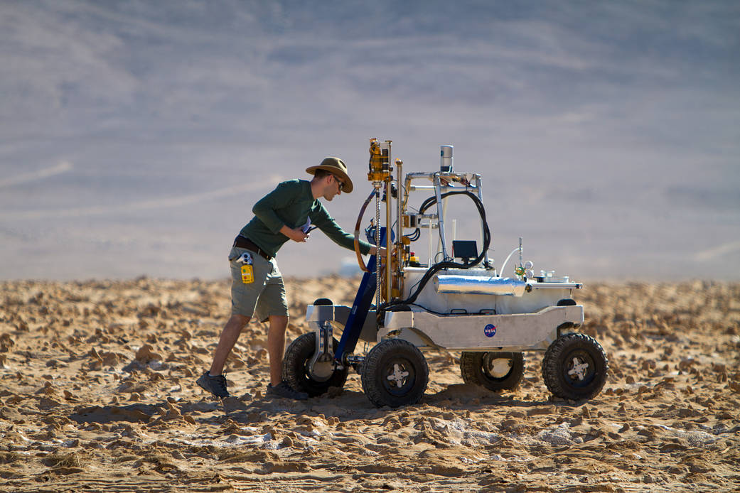 Engineer Dean Bergman works on the ARADS rover during recent field tests in the Atacama Desert.