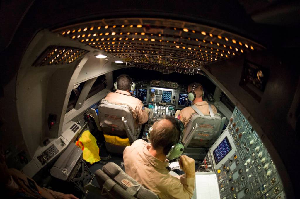 The cockpit of NASA's SOFIA 747SP is awash with instrumentation lights during one of nine Southern Hemisphere flights to study c