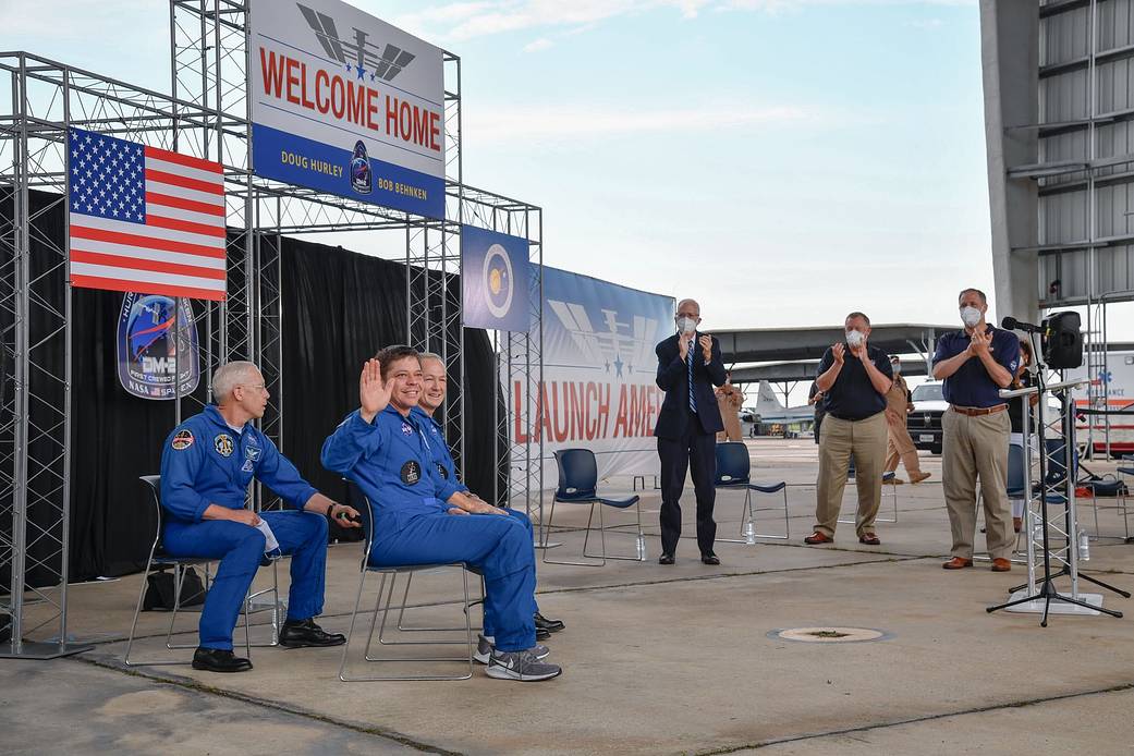 NASA leaders greet the DM-2 crew at Elligton Field Joint Reserve Base in Houston on Aug. 2, 2020.