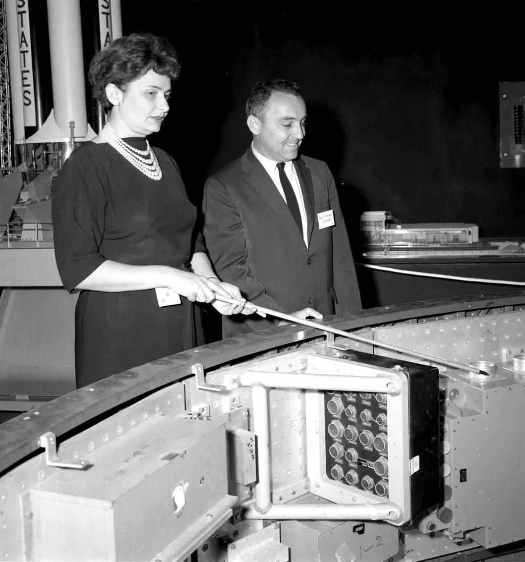 Evelyn Falkowski showing Israel Colonel Amos Horev a mockup of the Saturn I Instrument Unit in the Space Orientation Center.