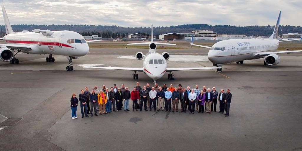 ATD-1 team posing in front of 3 aircraft.