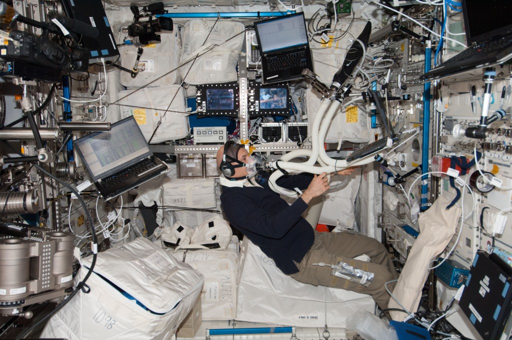 astronaut performs an oxygen uptake measurement session in the Columbus laboratory of the International Space Station
