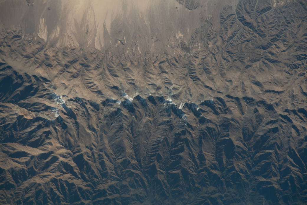 The snow-capped tips of the Andes Mountains