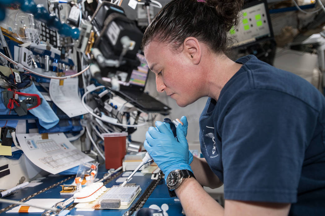 Astronaut Serena Auñón-Chancellor is pictured mixing protein crystal samples