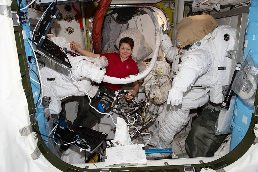 NASA astronaut Anne McClain works inside the Quest joint airlock