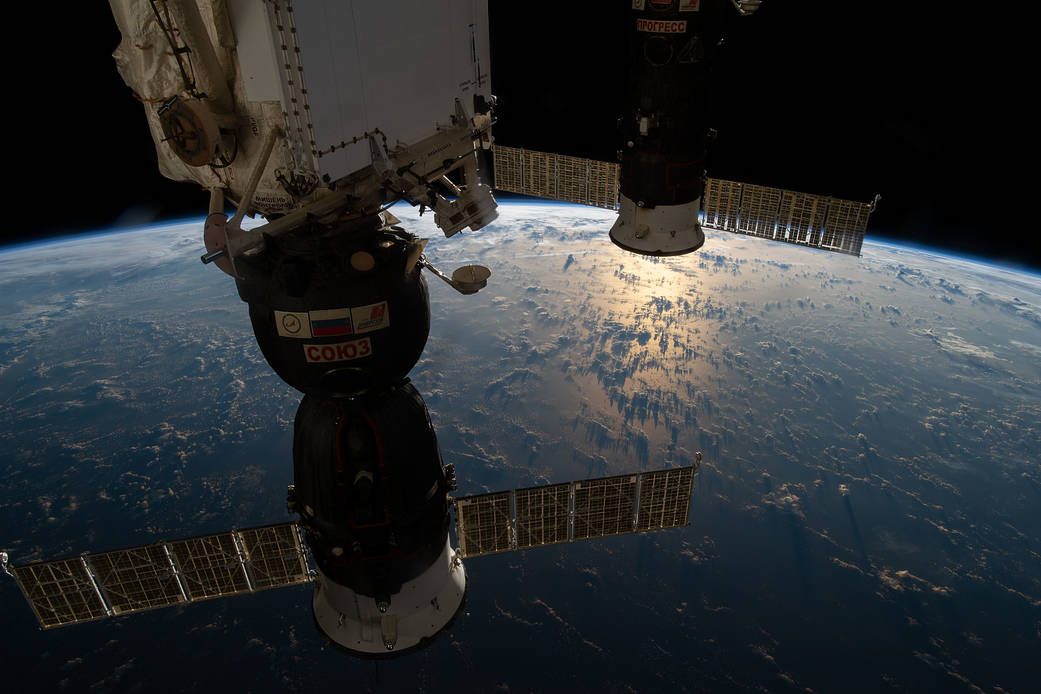 Two docked Russian spaceships above the Atlantic Ocean