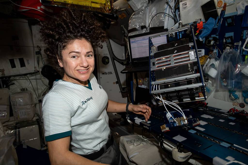 NASA astronaut Jessica Meir works on a 3-D biological printer