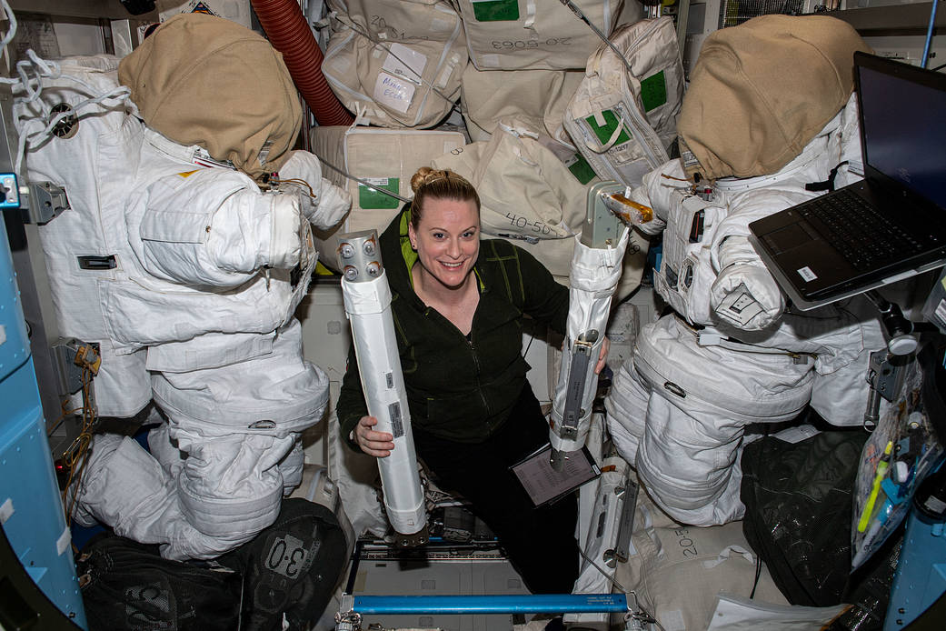 NASA astronaut Kate Rubins works with spacewalk hardware