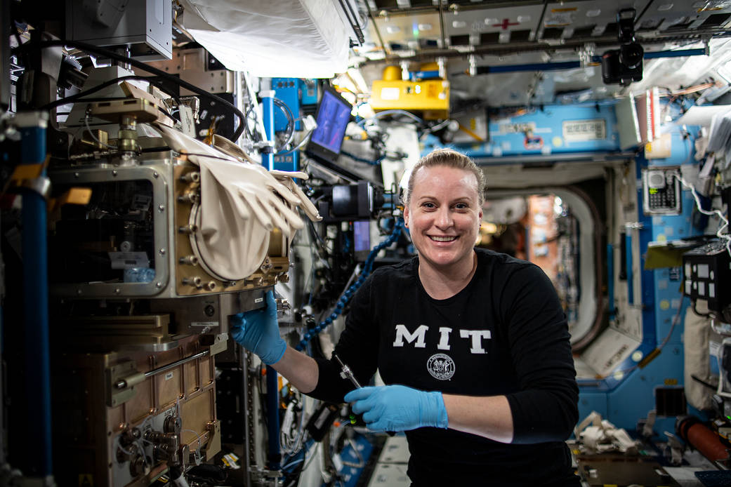 NASA astronaut Kate Rubins sets up the ACE-T-Ellipsoids study
