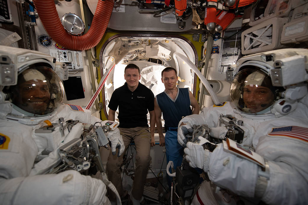 Team portrait during spacewalk preparations