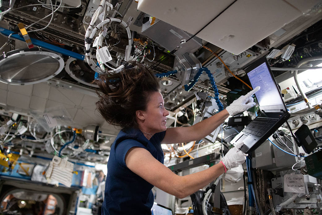 Astronaut Megan McArthur reviews science maintenance procedures