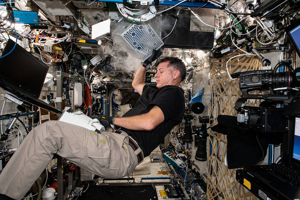 Astronaut Shane Kimbrough services hardware inside a science freezer