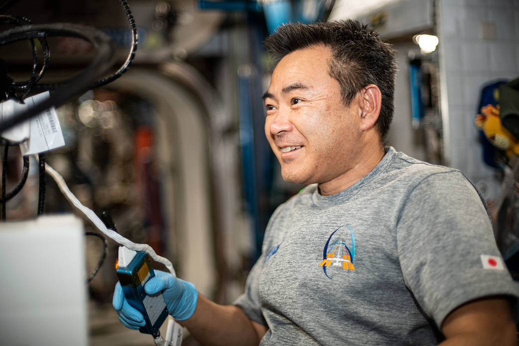Commander Akihiko Hoshide works aboard the International Space Station