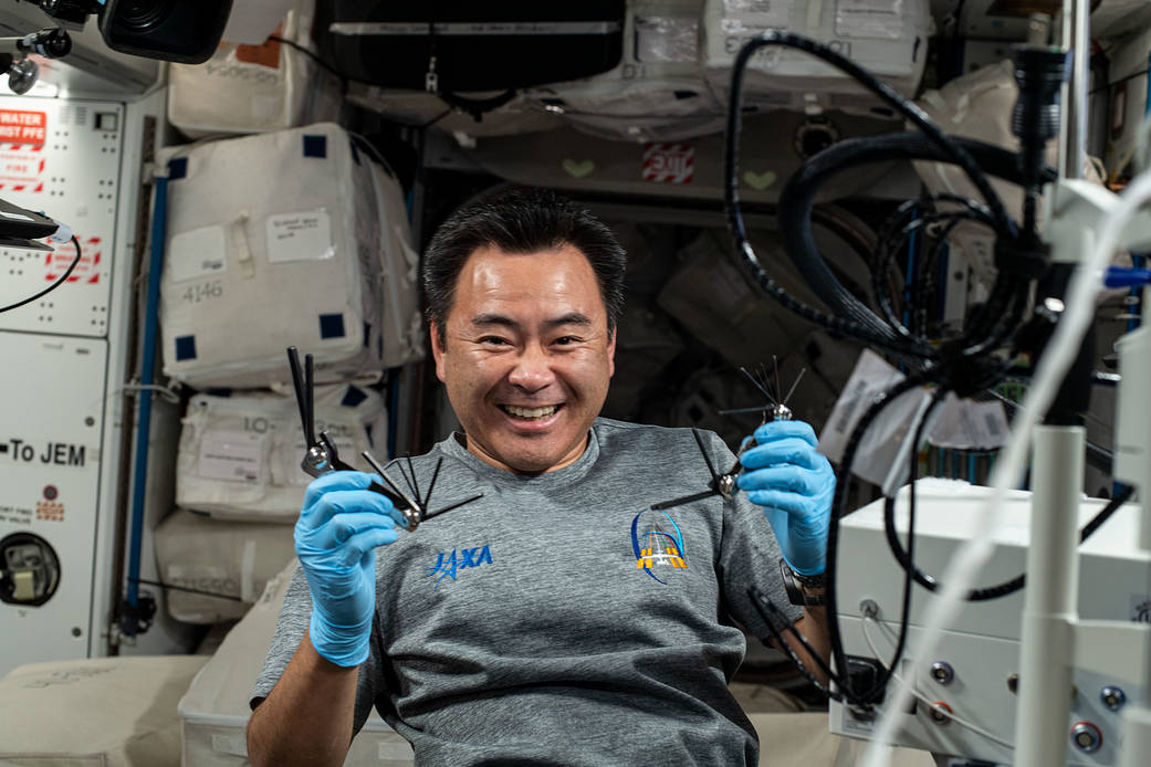 Expedition 65 Commander Akihiko Hoshide displays hardware