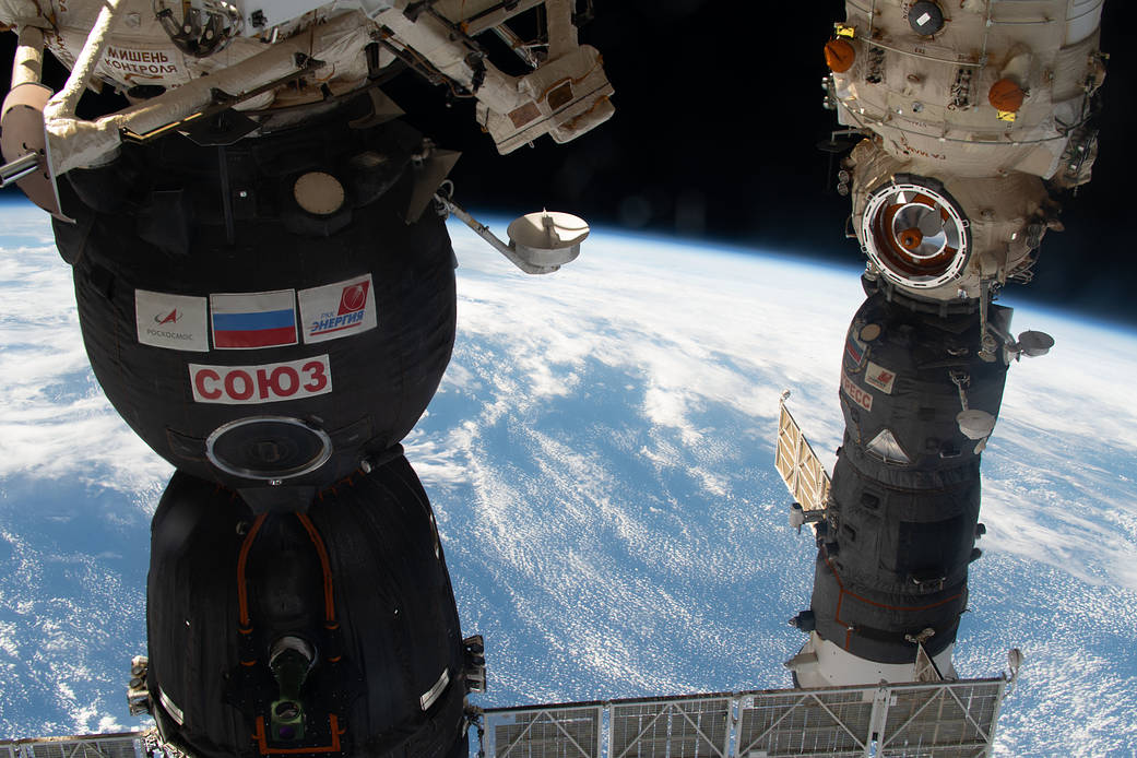 Two Russian spaceships are pictured docked to the station