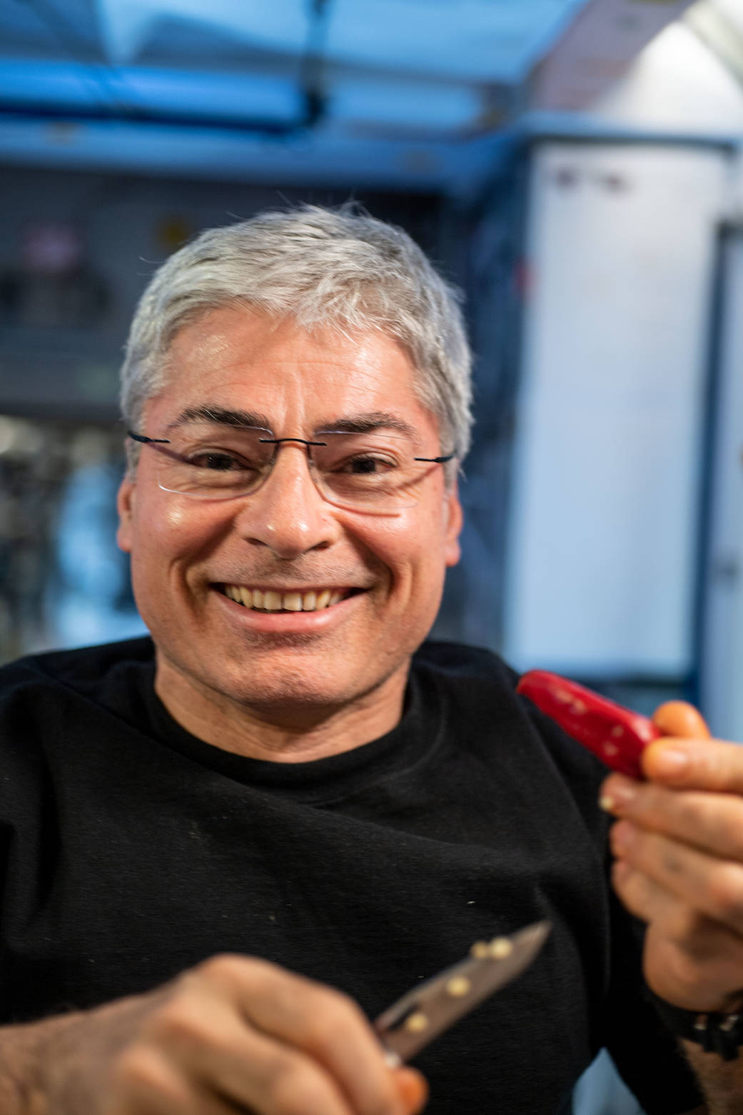 Astronaut Mark Vande Hei shows off a fresh chile pepper