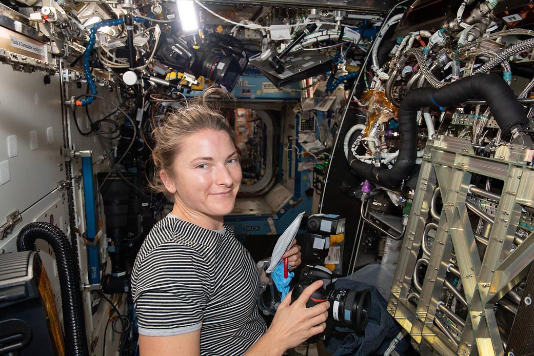 Astronaut Kayla Barron inspects components inside the Materials Science Research Rack