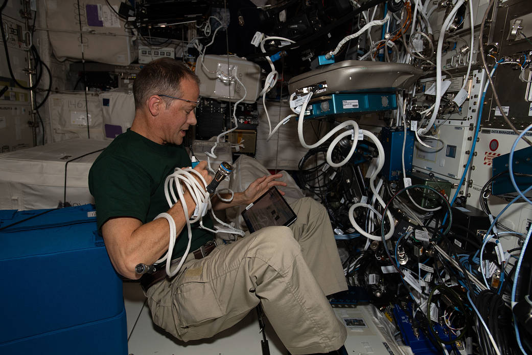 Astronaut Thomas Marshburn sets up hardware for the Vascular Echo study